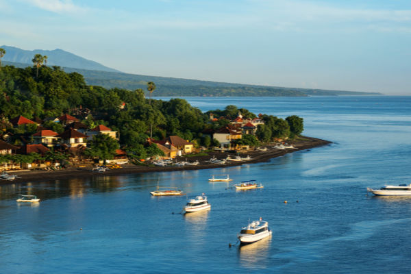 Scenic lagoon with boats in small village Amed on the east of Ba