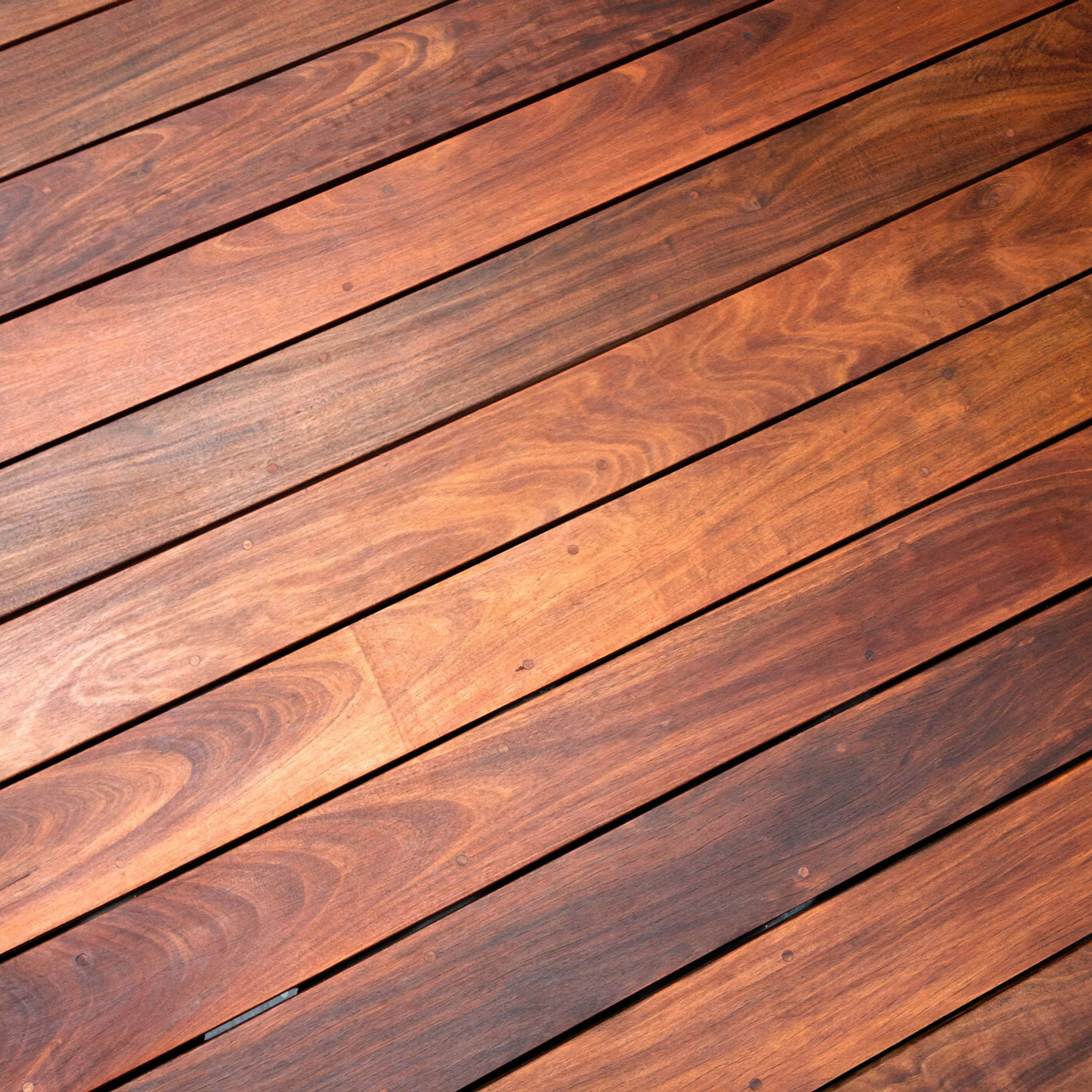 Wood decking material for swimming pool area