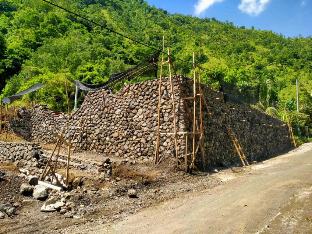 River stone boundary wall on the property develop in Amed.