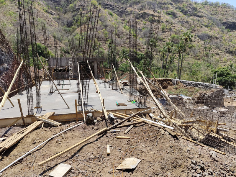 Lower floor foundations of villa under construction with steel rebar columns