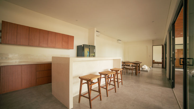 Kitchen with island bar in a luxury villa for sale in Amed.