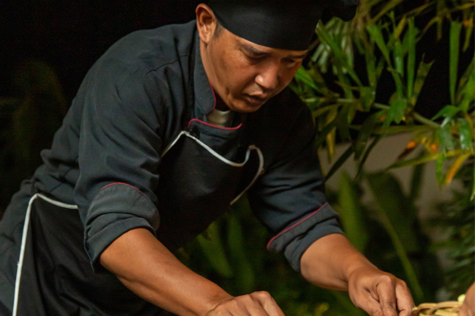 Private chef finishing a dish in the villa at Vesica Villas Resort in Amed.